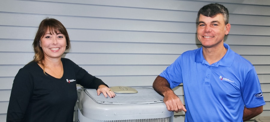 Air Conditioning Installation RJ owners Julius and Erin stand with a new air conditioning installation performed for residential customer.